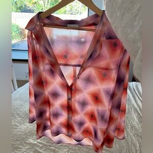 colorful patterned button-down blouse.